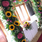 sunflowers around window