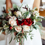 holding a bouquet of roses
